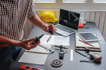 The factory mechanical engineering team is designing and developing gear sets to keep the machines running perfectly because gear sets are essential in the working system of large machines.