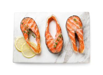 Tasty grilled salmon steaks, lemon and thyme isolated on white, top view