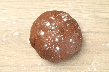 Chocolate dough on wooden table, top view