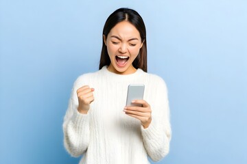 Fototapeta premium Excited and joyful Asian woman celebrates an achievement or success while holding a smartphone in a 3D rendering The woman has a clenched fist and an expression of happiness enthusiasm and triumph