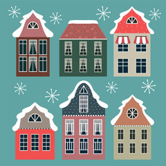 Fototapeta premium Set of retro old houses with snowflakes on blue background. 