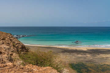 Maio islands beautiful empty sandy beach with turquoise clear ocean water with blue sky