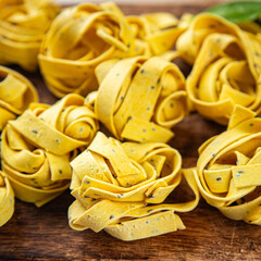 tagliatelle with chia seeds raw pasta vegetable dish Fresh delicious gourmet food background On the...