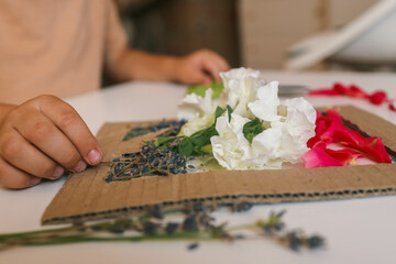 Fototapeta premium Handmade Mother's Day surprise. Top view of origami flowers