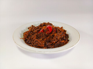 Yummy minced black pepper beef, tender and flavorful, served in a white bowl against a pristine white background. A savory dish, perfect for enjoying with rice or noodles
