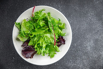 green salad leaves mix salad fresh meal food snack on the table copy space food background rustic top view 