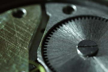 Mechanism of vintage wrist watch as background, closeup