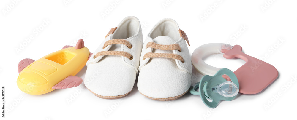 Poster Colorful rattles, baby shoes and pacifier isolated on white