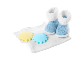 Baby toys, body and booties isolated on white