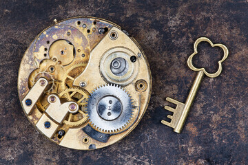 Golden clockwork with a key. Idea, creativity or brainstorming concept.