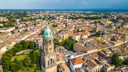 An aerial view of Parma, Italy, showcasing the iconic Cattedrale di Parma and the Battistero di...