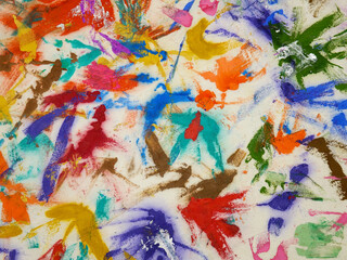 Multi-colored spots of different shapes from paint brushes with gouache and acrylic paint on white...