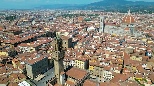 An aerial view of Florence, Italy, captured by a drone, highlighting the city's stunning Renaissance architecture and iconic landmarks. Florence, the cradle of the Renaissance, is renowned for it