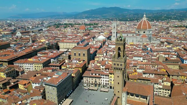 An aerial view of Florence, Italy, captured by a drone, highlighting the city's stunning Renaissance architecture and iconic landmarks. Florence, the cradle of the Renaissance, is renowned for it