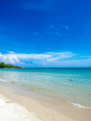 Seascape view with white sand, quiet beach, clear sea water, blue sky in summer of Koh Samet (Samet Isalnd) in Thailand