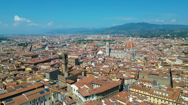An aerial view of Florence, Italy, captured by a drone, highlighting the city's stunning Renaissance architecture and iconic landmarks. Florence, the cradle of the Renaissance, is renowned for it
