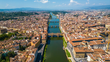 Obraz premium An aerial view of Florence, Italy, captured by a drone, highlighting the city's stunning Renaissance architecture and iconic landmarks. Florence, the cradle of the Renaissance, is renowned for it