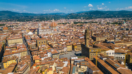 An aerial view of Florence, Italy, captured by a drone, highlighting the city's stunning Renaissance architecture and iconic landmarks. Florence, the cradle of the Renaissance, is renowned for it