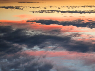 Fototapeta premium Dark Moody Thunder Clouds Sunset Clouds in a Blue Sky as A Skyscape Background