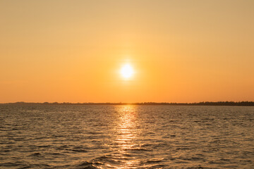 Naklejka premium Beautiful sunset over the sea. Viewed from a boat.