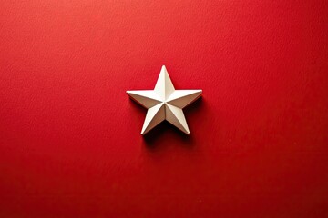 Obraz premium Minimalist Christmas background with a simple white star on a red backdrop