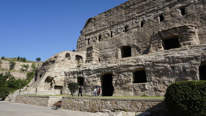Fototapeta premium Yungang Caves and Grutes in the stone mountain with holes in Datong China tourist attraction