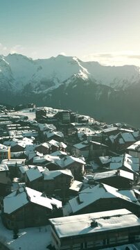 Aerial view of hotels of Alpe d'Huez ski resort in France, vertical video