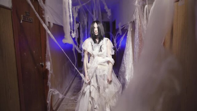 Ghost or zombie in an abandoned haunted house at night. Halloween festival concept,Ghost movies
