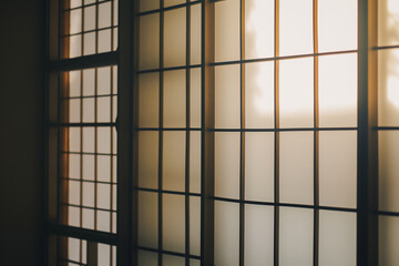 Sunlight Filtering Through Traditional Wooden Lattice Screens in Minimalist Room