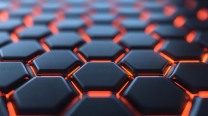 Fototapeta premium A close-up view of a hexagonal pattern with glowing orange edges on a sleek black surface, showcasing modern design and technology.