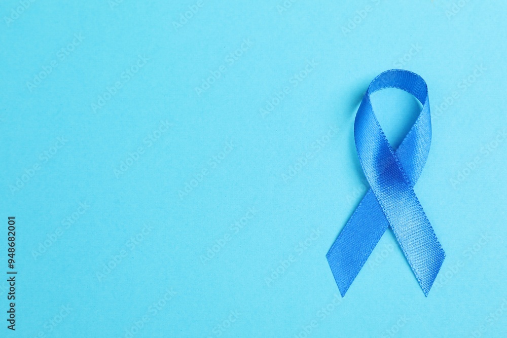 Wall mural blue ribbon on color background, top view with space for text. prostate cancer awareness