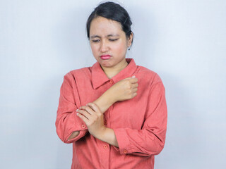 Young asian business woman wearing casual shirt suffering pain on hands, arthritis inflammation