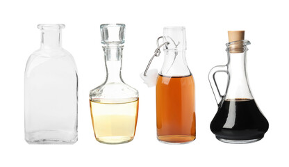 Different types of vinegar in glass bottles isolated on white, set