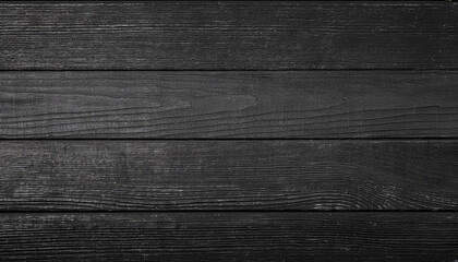 Fototapeta premium Black wooden planks, showing the intricate grain and texture of the wood. The dark color and rustic feel of the planks provide a simple, yet elegant backdrop.