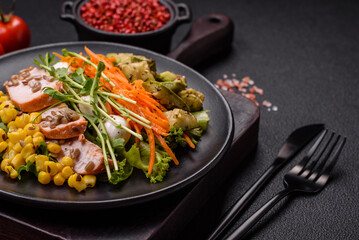 Fresh juicy salad with meat, mozzarella, carrots, lettuce, corn
