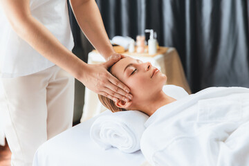 Caucasian woman enjoying relaxing anti-stress head massage and pampering facial beauty skin...