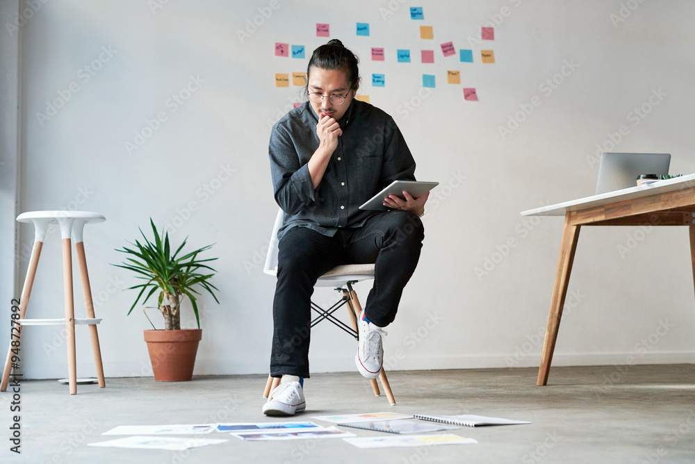 Poster thinking, man and graphic designer research on tablet with documents for creative idea, planning or 