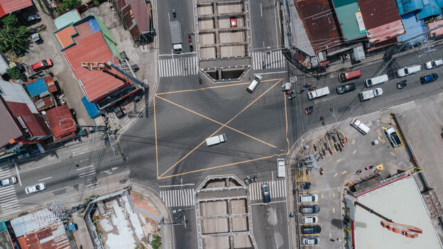 Aerial View of Busy Urban Intersection with Traffic in Lucena, City, Quezon Province, Philippines