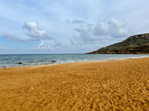 Beautiful sandy beach on the Coast of the island of Gozo, Malta. The Mediterranean Sea.
