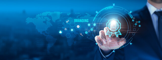 Branding Concept: Businessman touching branding icon on virtual interface, identity, strategy,...