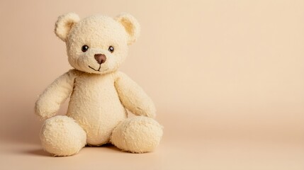Obraz premium A soft, plush teddy bear sitting on a light pastel background, showcasing its intricate stitching and lifelike features