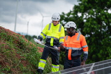 Fototapeta premium Service engineer inspects and maintains solar panels in a cultivation area, promoting clean energy.