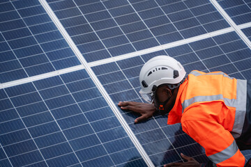 Service engineer inspects and maintains solar panels in a cultivation area, promoting clean energy.