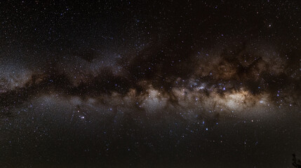 Fototapeta premium starry night sky, showcasing a vast galaxy filled with twinkling stars. The cosmic landscape captures the endless mysteries of the universe
