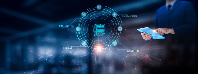 Document Management: Businessman using tablet analyzing document management record on tablet. Digital filing system and network connection on modern virtual screen interface, technology, and network.