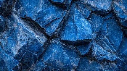 An abstract background featuring blue rocks with varying textures and shades. The organic shapes and cool tones create a visually intriguing, serene, and artistic composition.