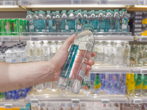 reading information on a bottle of water