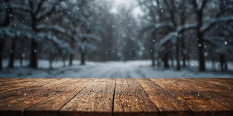 empty wooden table with blurred winter background.