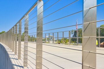 Wire metal guard rail on a walkway bridge