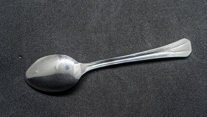 Silver Spoon on Dark Background - Elegant and Minimalist Design
